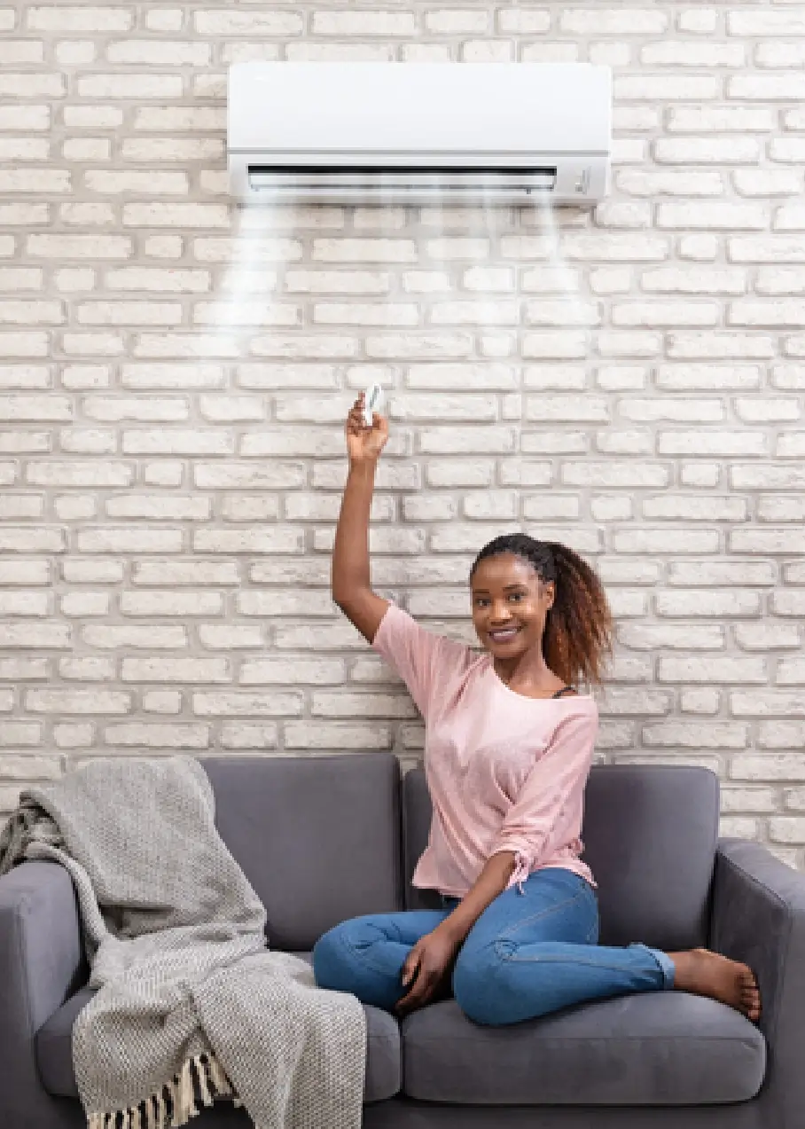 woman operating a ductless unit