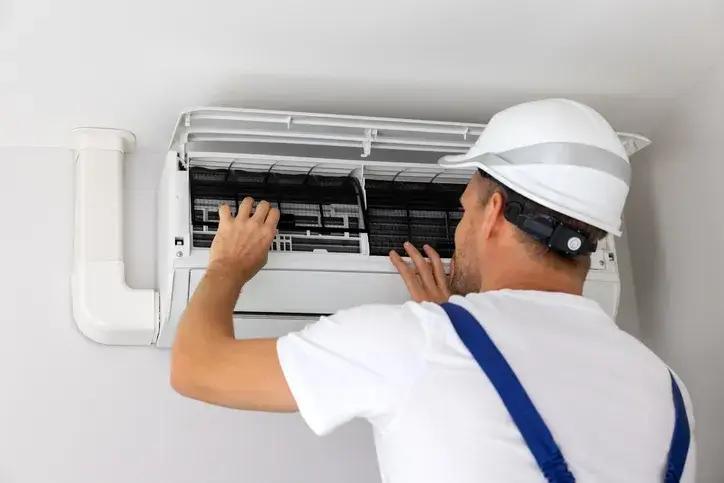 technician servicing a ductless mini-split