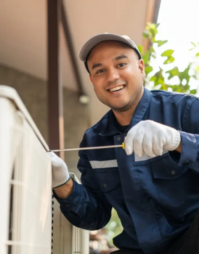 technician servicing an HVAC system