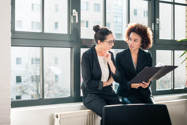 office workers sitting by radiator