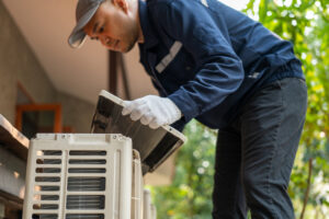 technician checks out AC system