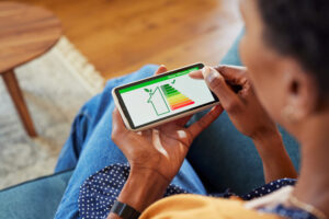 Woman checking the energy efficiency of her home