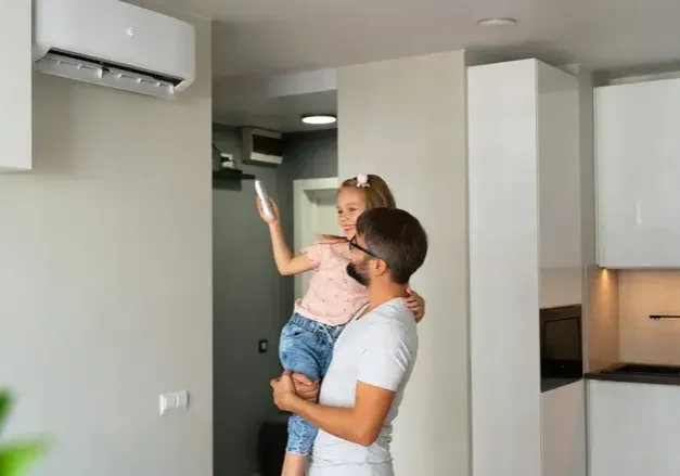 father and daughter operating a ductless system