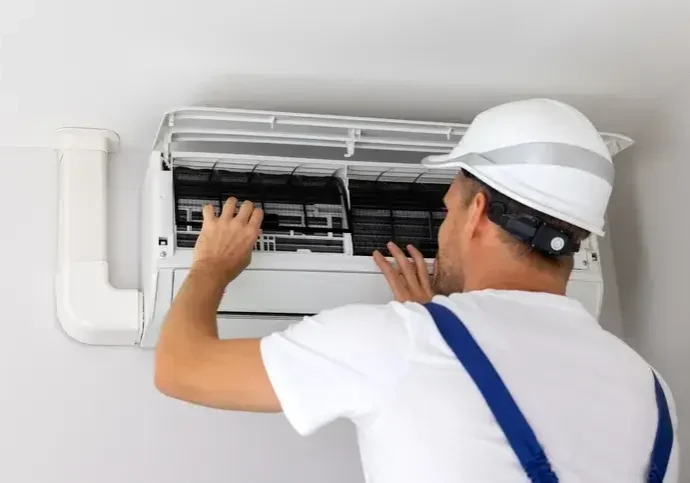 technician servicing a ductless mini-split